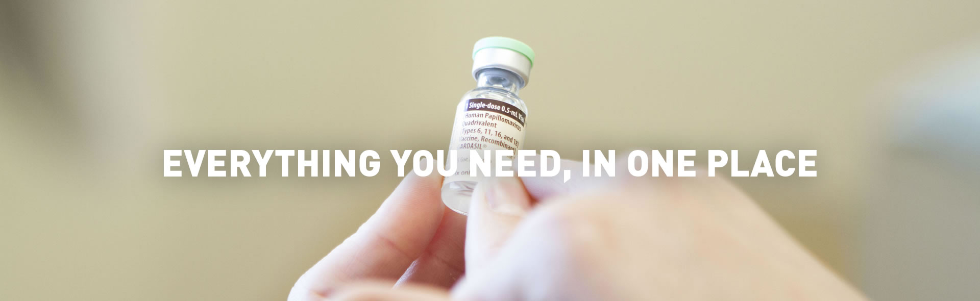nurse pointing to vaccine